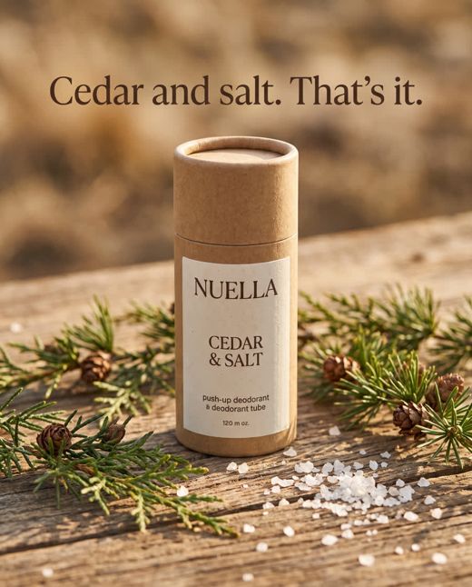 A Nuella deodorant tube on a cedar board